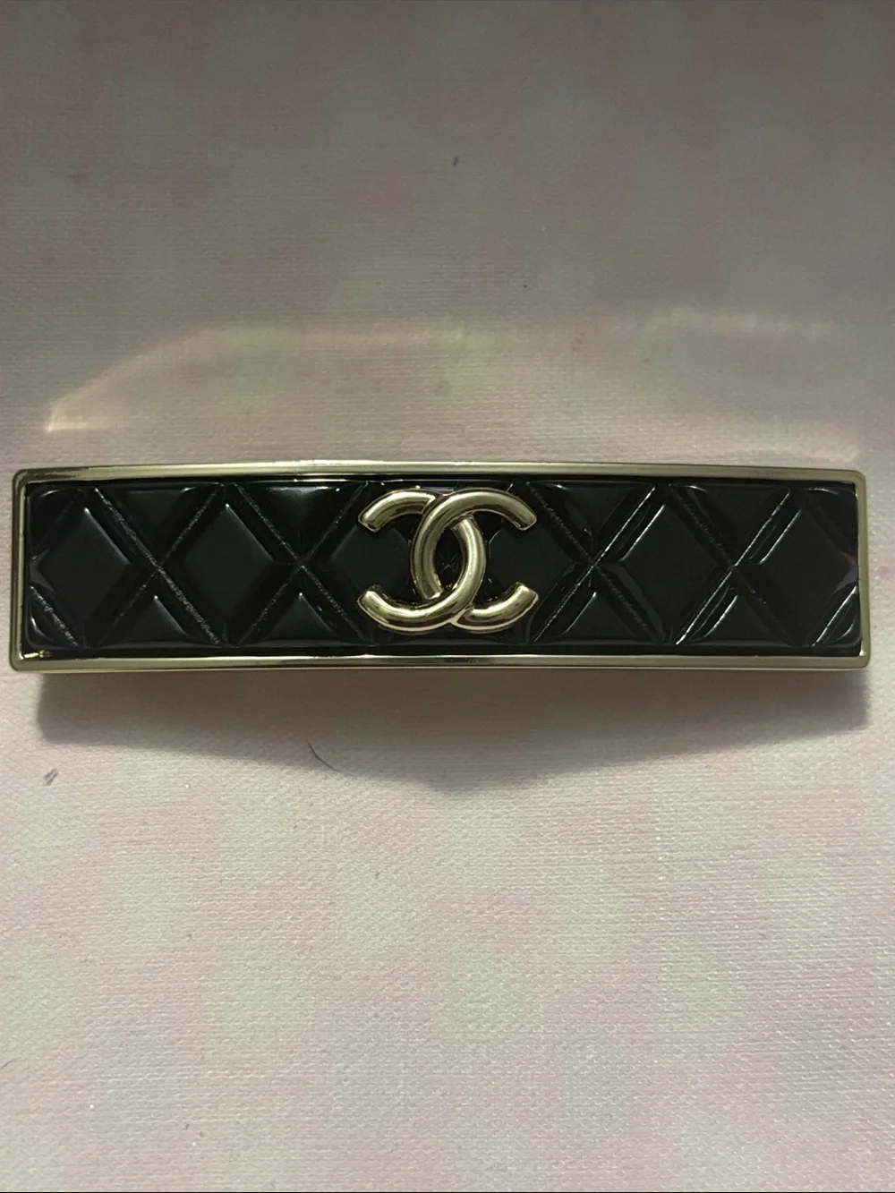 CHANEL Black Quilted Logo Hair Barrette with Gold-Tone Trim